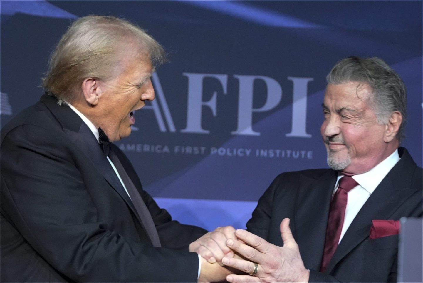 President-elect Donald Trump greets actor Sylvester Stallone during an America First Policy Institute gala at his Mar-a-Lago estate on Nov. 14, 2024, in Palm Beach, Fla.