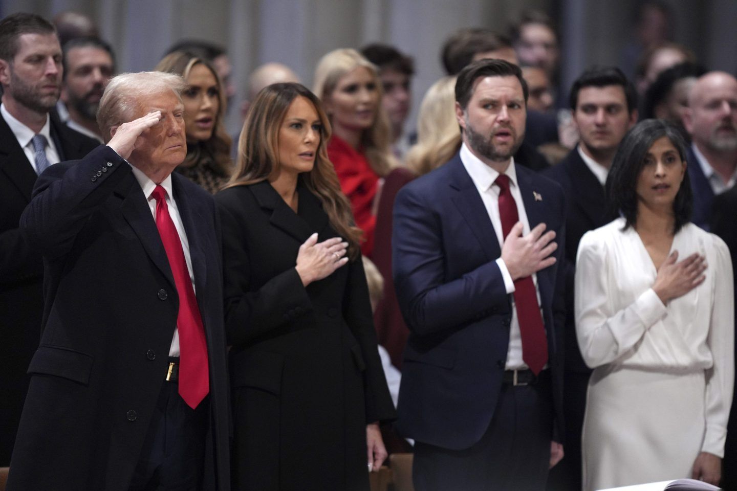 President Donald Trump, from left, salutes alongside first lady Melania Trump, Vice President JD Vance and his wife Usha Vance during the national prayer service at the Washington National Cathedral, on Jan. 21, 2025, in Washington.