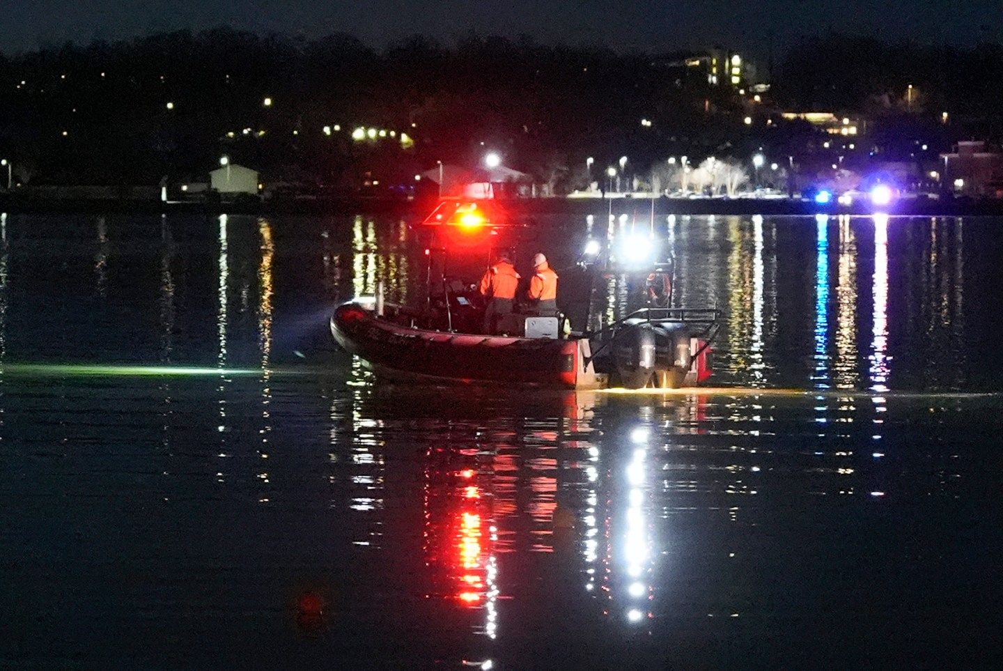 A boat works the crash scene near Ronald Reagan Washington National Airport, on Jan. 30, 2025, in Arlington, Va. 