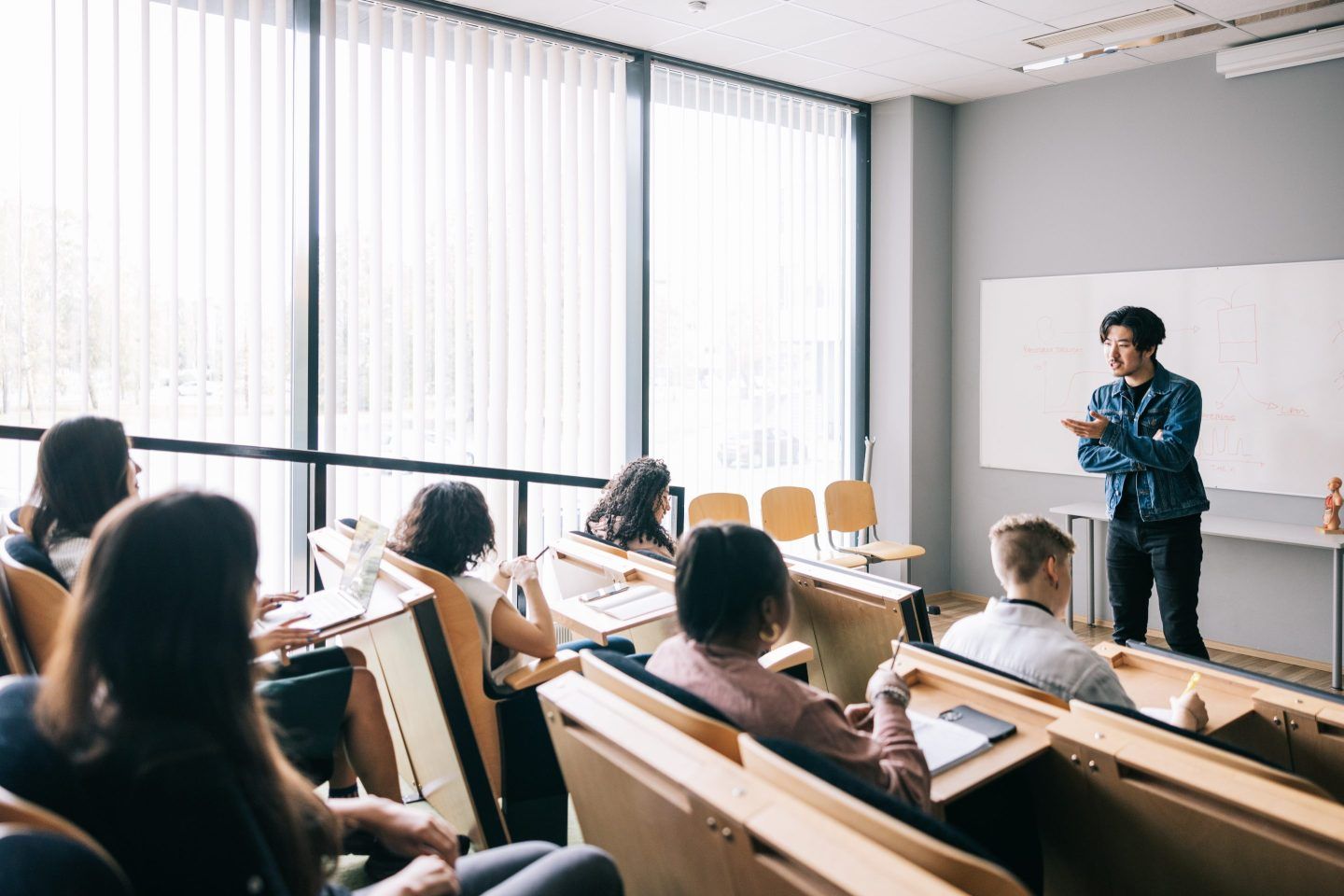 Group of students attending university seminar