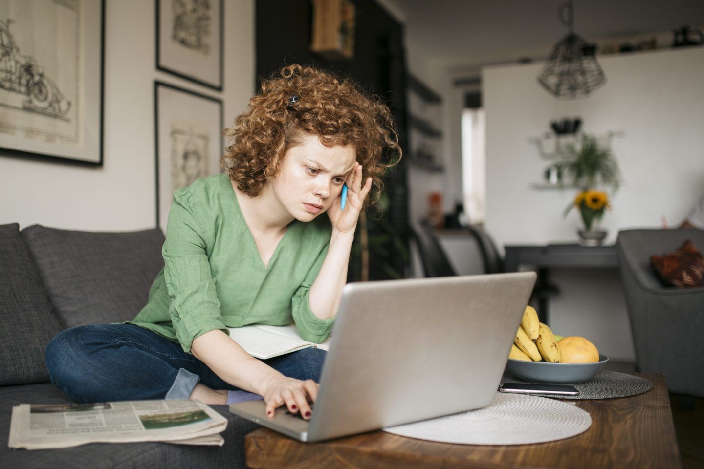 Frustrated job seeker searches for roles on computer.