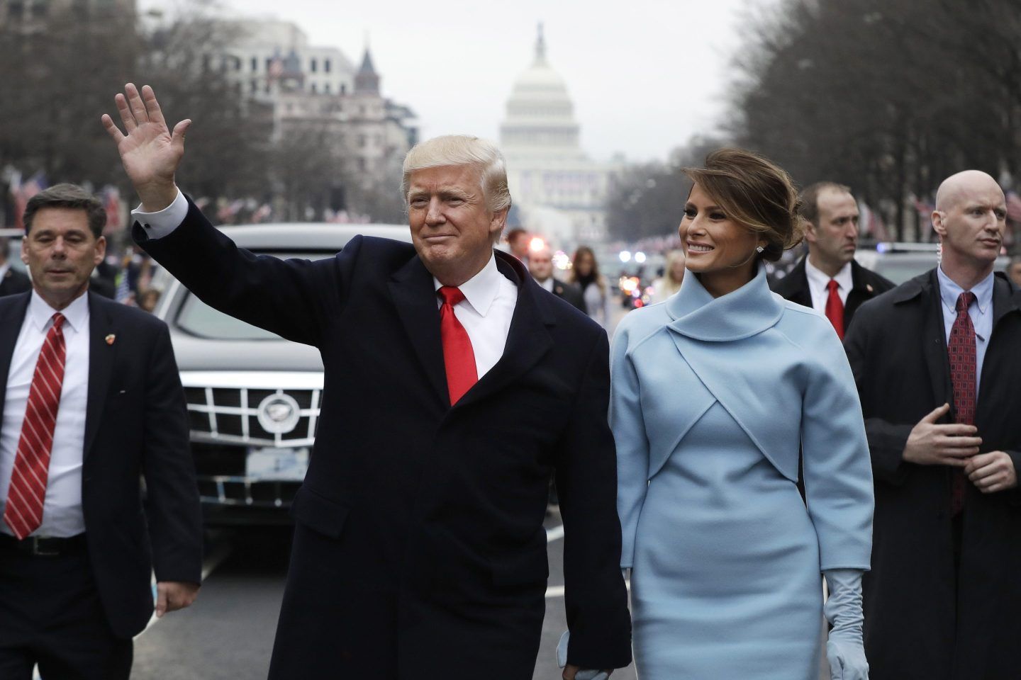 Donald Trump and his wife Melania wave during Trump's first inauguration in 2017