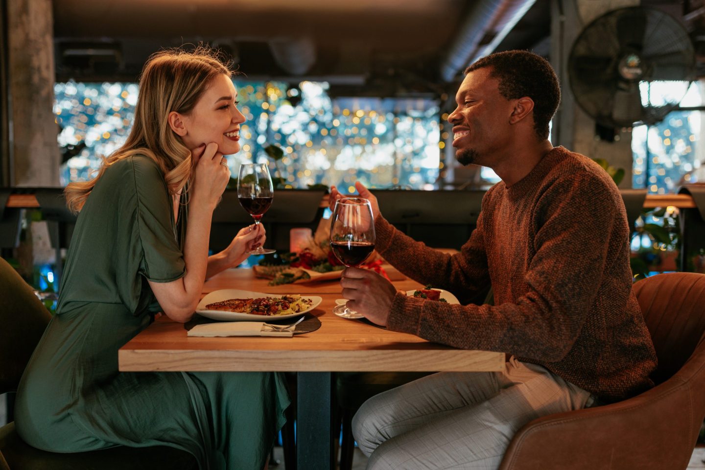 man and woman having dinner in a nice restaurant