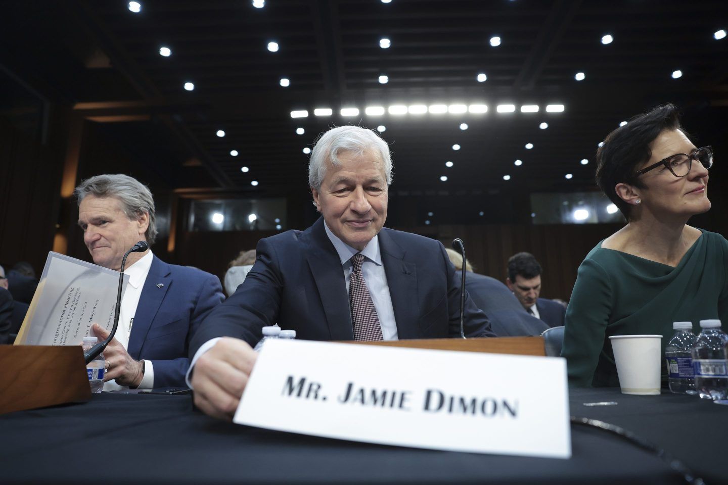 Jamie Dimon (center), longtime CEO of JPMorgan Chase.
