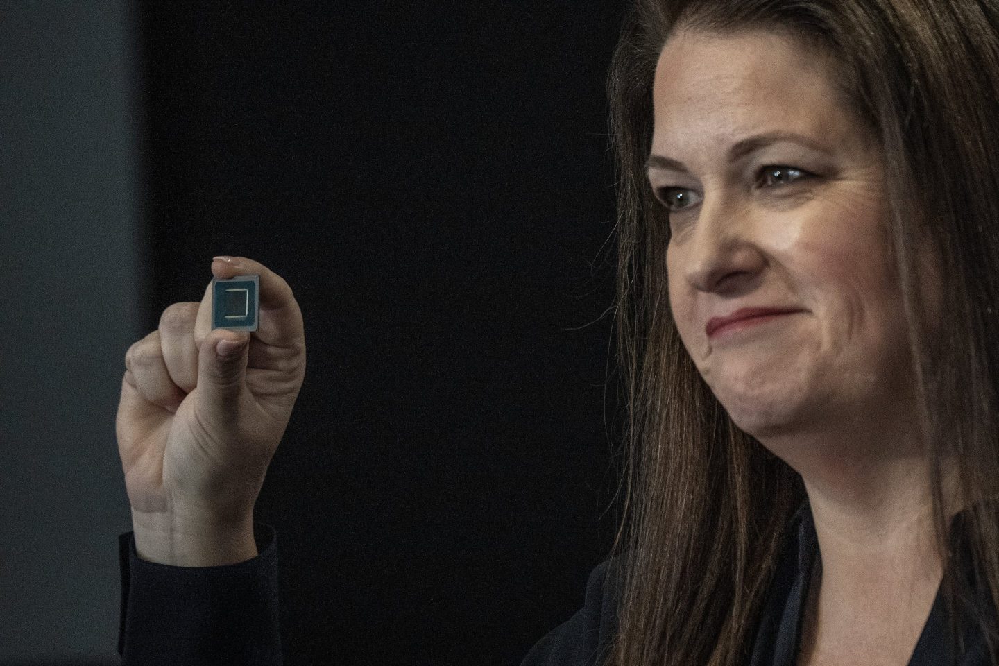 Michelle Johnston Holthaus, executive vice president and general manager of the Client Computing Group at Intel Corp., holds a Intel Core Ultra processor as she speaks during the Intel AI Everywhere launch event in New York, US, on Thursday, Dec. 14, 2023.