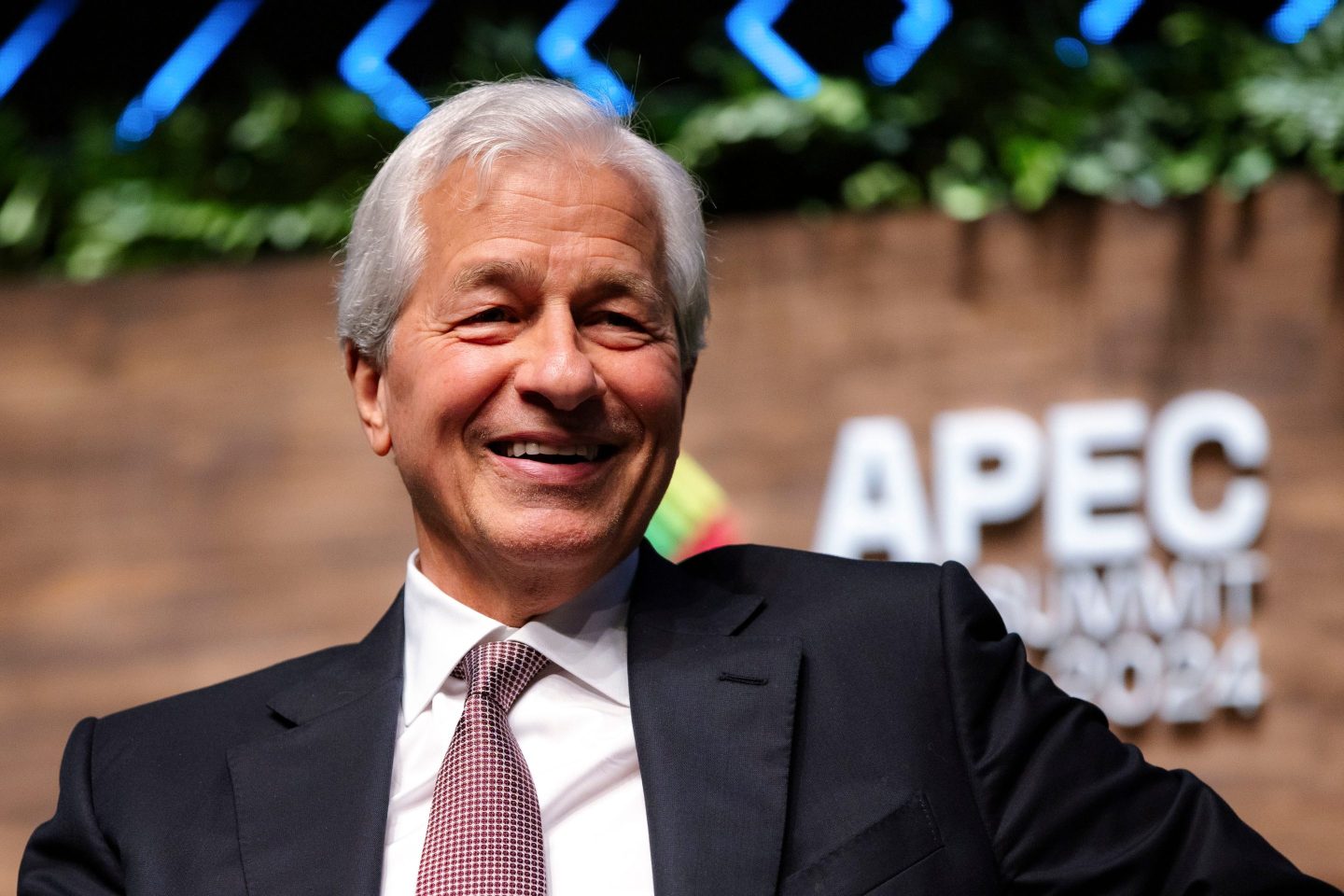 Jamie Dimon smiling wearing a suit
