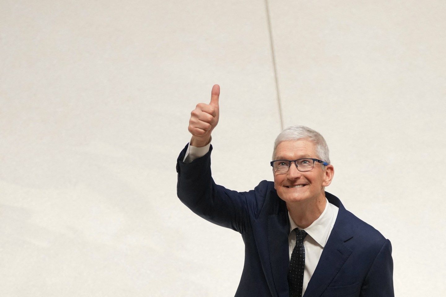Apple CEO Tim Cook during a visit of the firm's UK headquarters in London on December 12, 2024. (Photo: Kin Cheung/POOL/AFP/Getty Images)