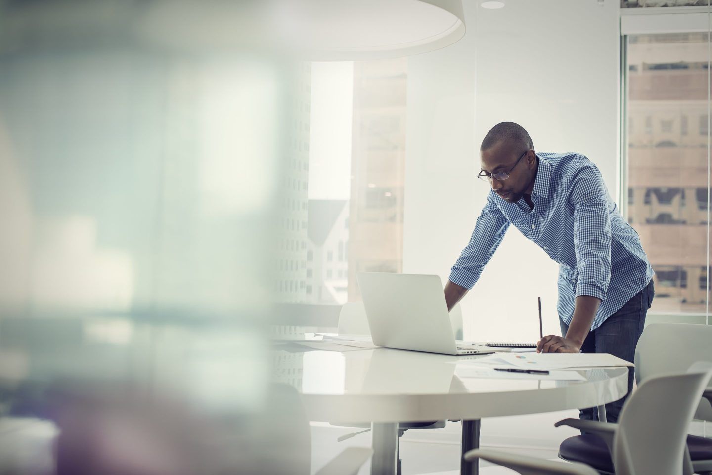 A man is looking at a laptop