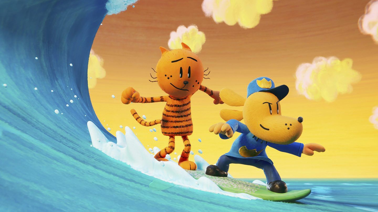 An image from the movie "Dog Man" shows an orange cat riding on a surfboard piloted by a dog in a police officer's uniform