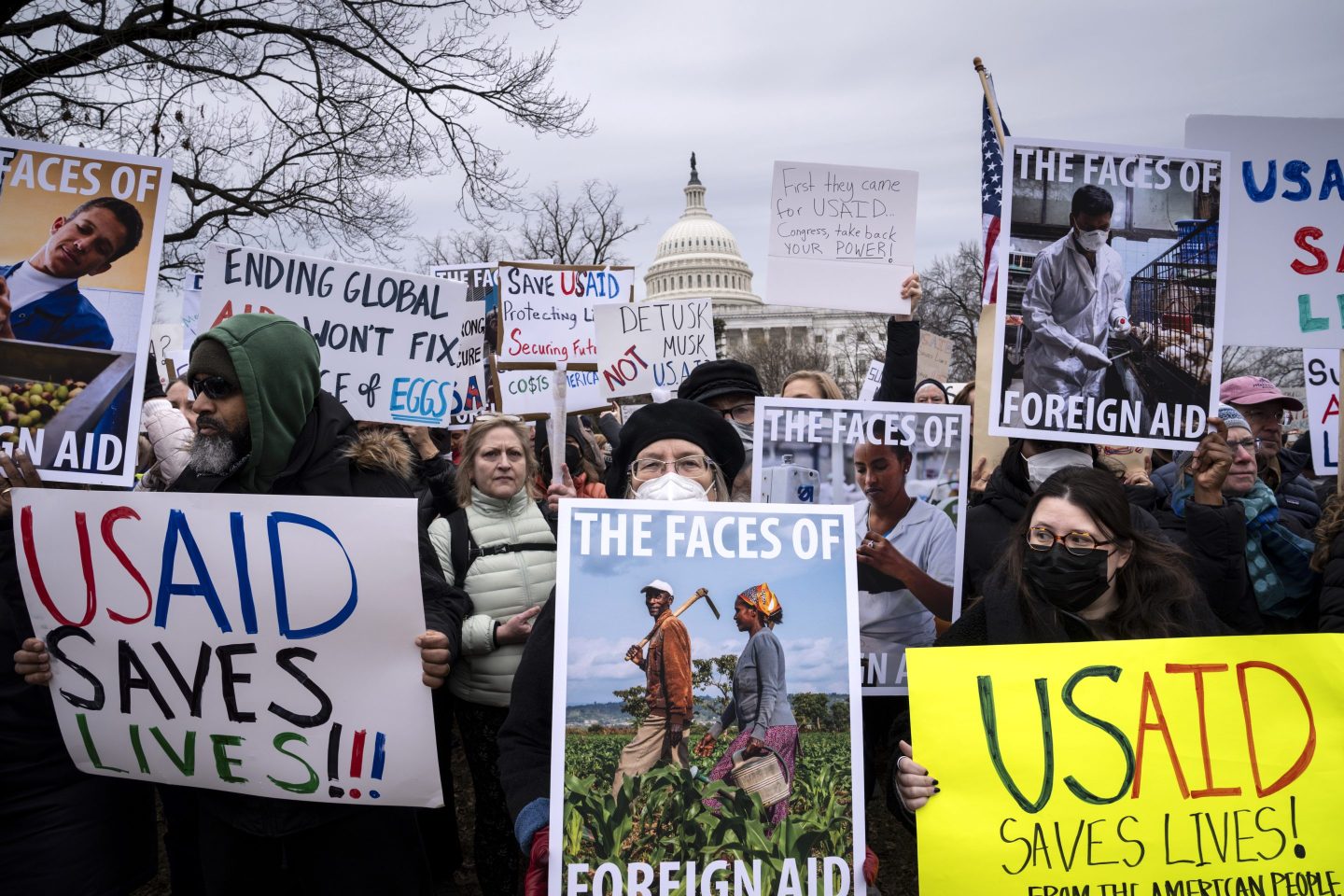 Demonstrators and lawmakers rally against President Donald Trump and his ally Elon Musk as they disrupt the federal government, including dismantling the U.S. Agency for International Development, which administers foreign aid approved by Congress, on Capitol Hill in Washington, on Feb. 5, 2025. 