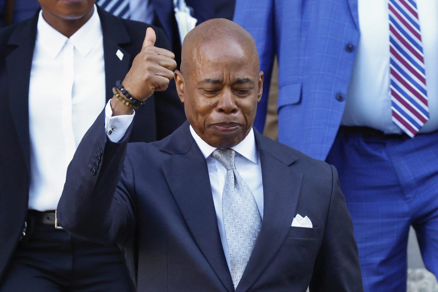 NYC Mayor Eric Adams closes his eyes, smiles, and gives a thumbs up