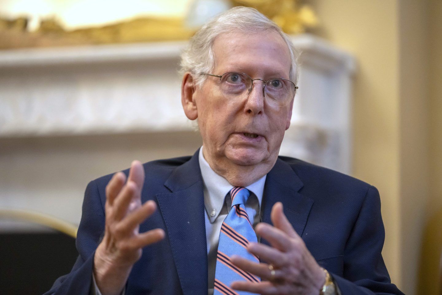 Mitch McConnell speaks while gesticulating