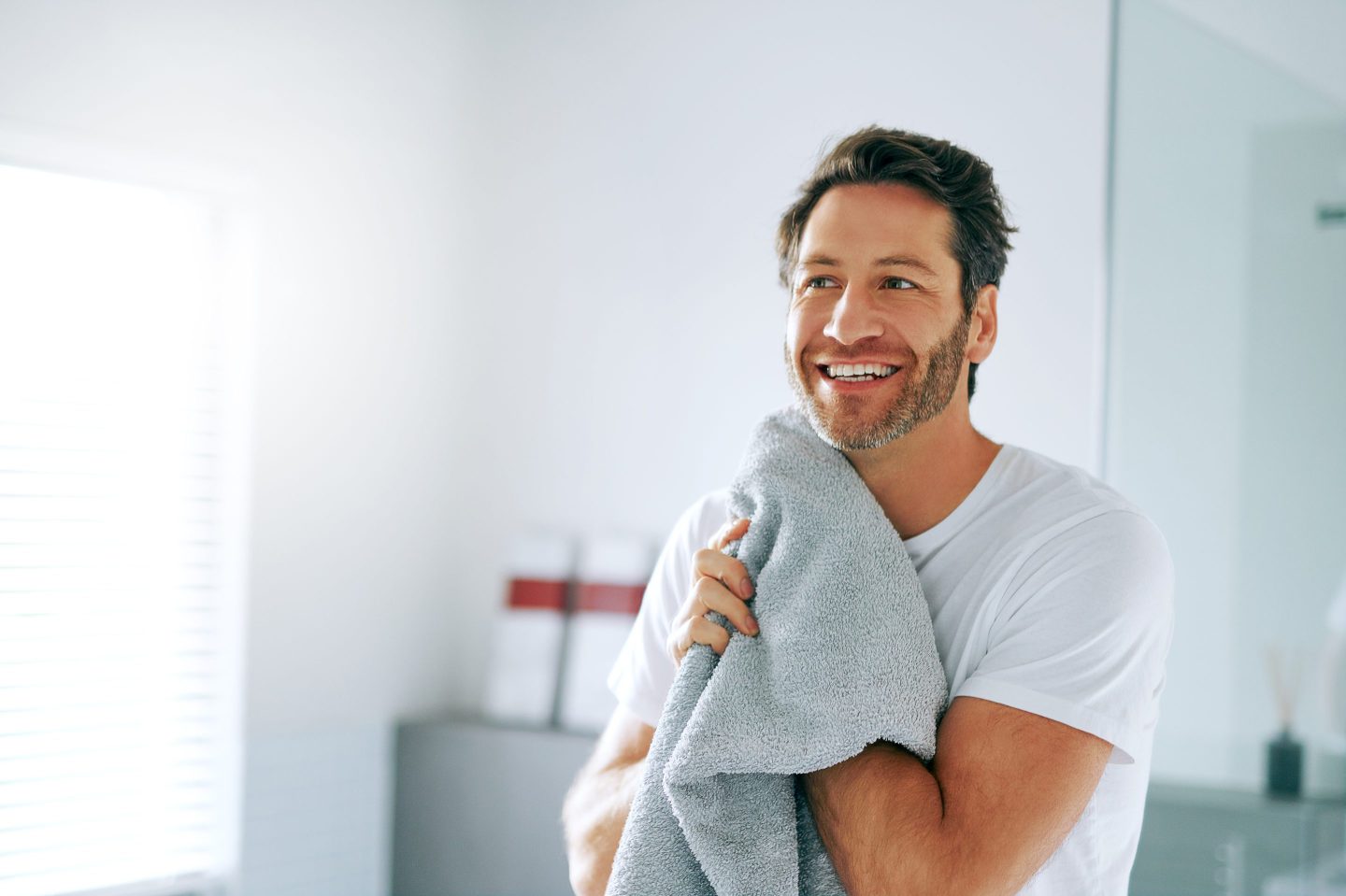Cropped shot of a handsome middle-aged man going through is morning routine in the bathroom