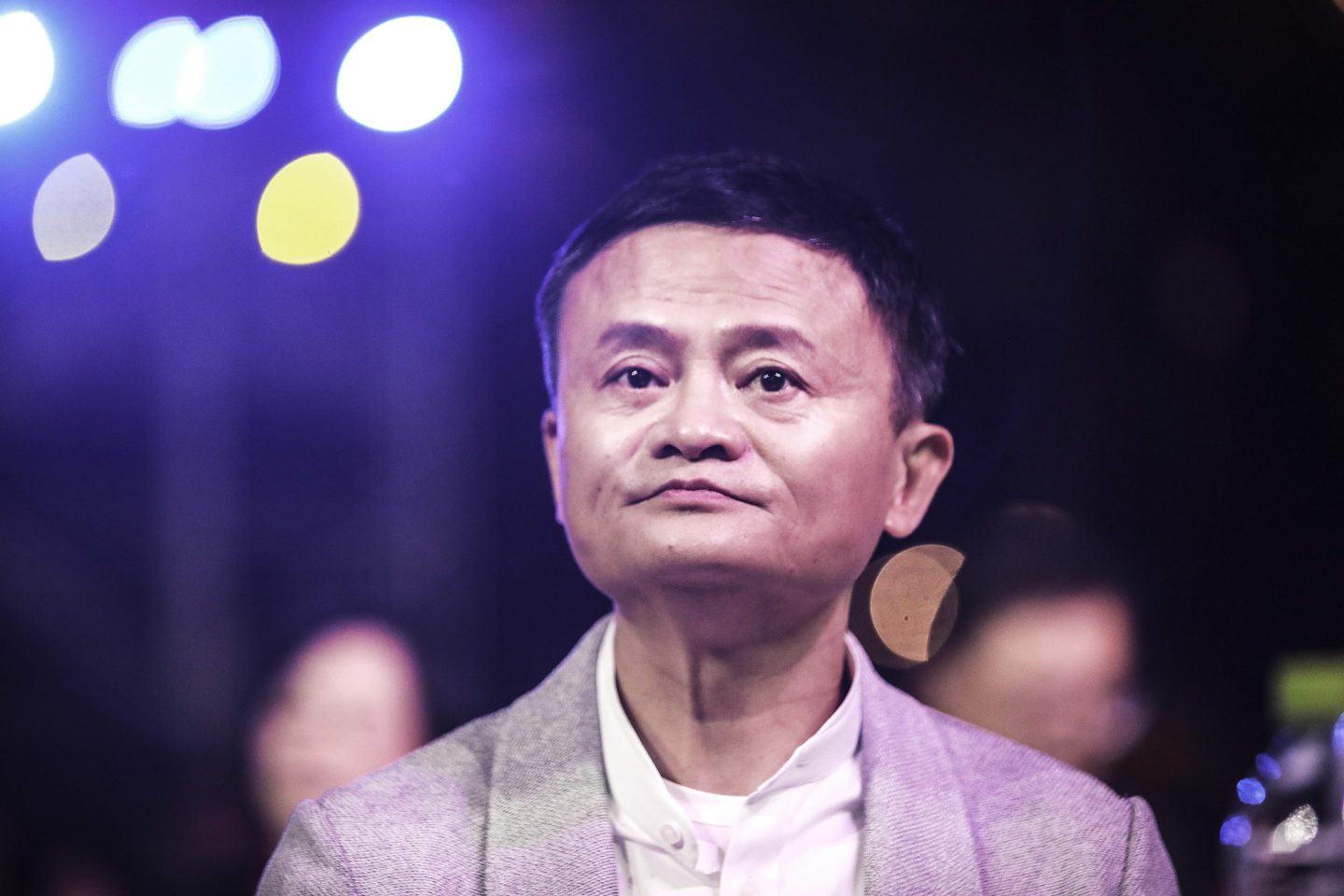 Jack Ma sits, looking defeated