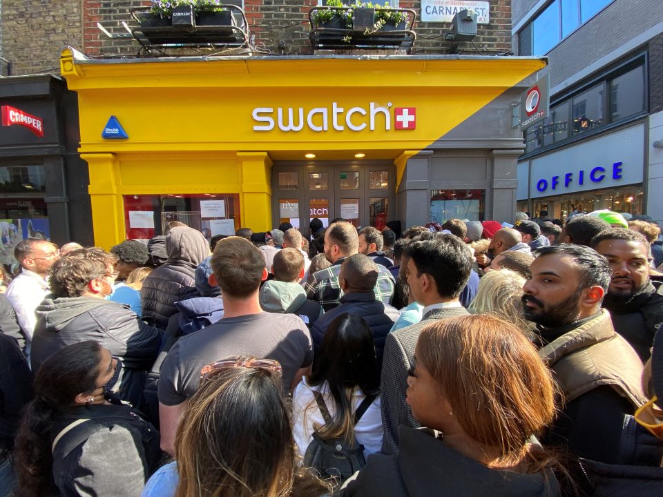 Customers crowd outside Swatch's store in Carnaby, London, following the launch of MoonSwatch in 2022.