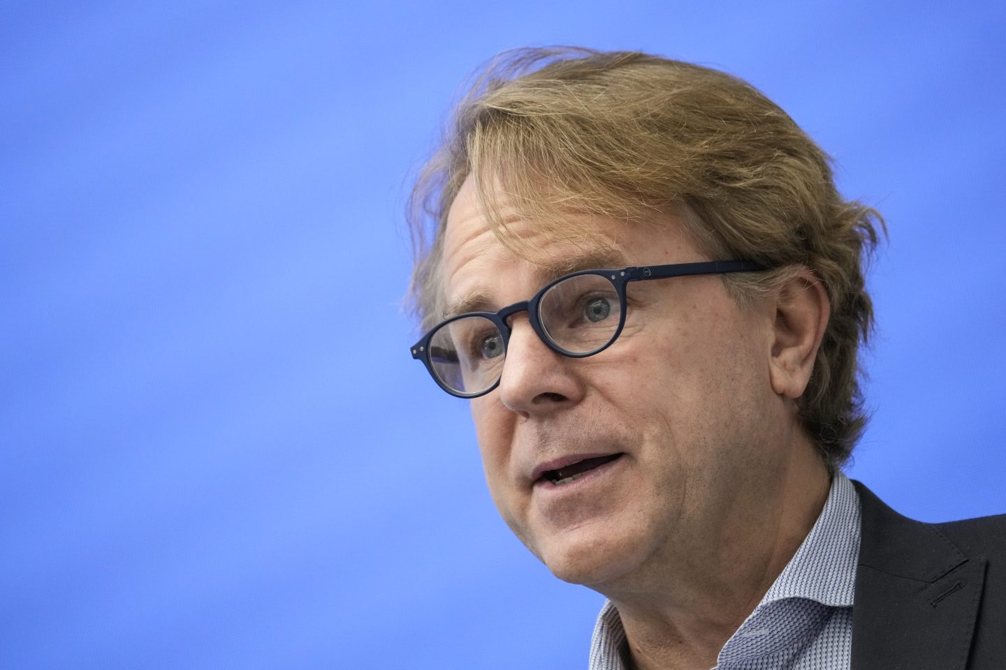 Semafor CEO Justin Smith speaks into a microphone