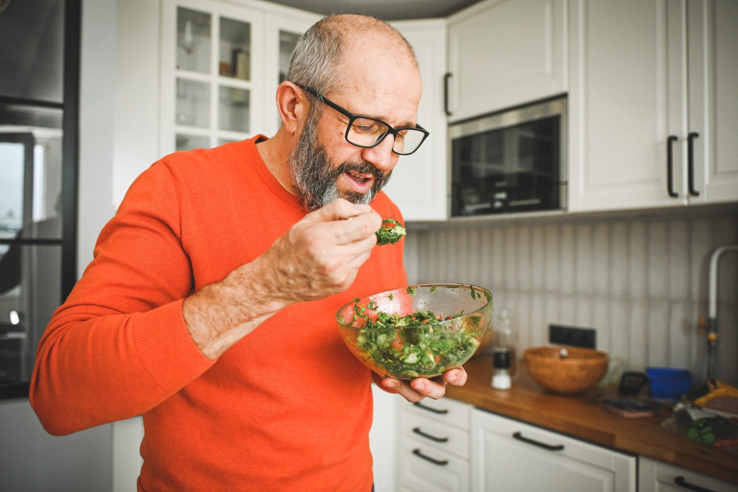 man eating vegetable salad