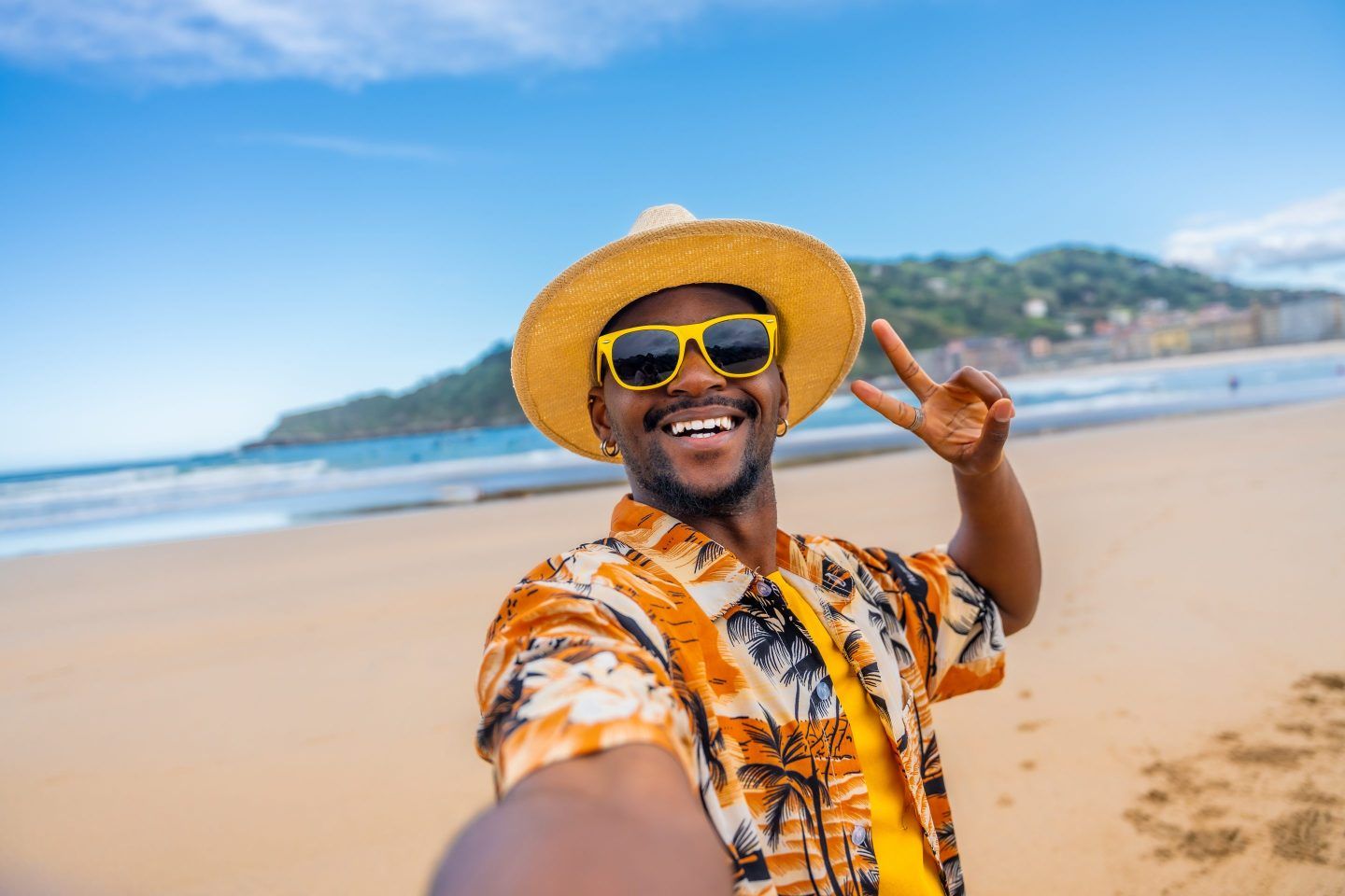 Man taking selfie on a beach