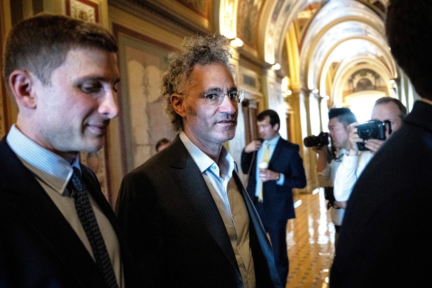 Alex Karp in the hallway of the U.S. Capitol looks at the camera.