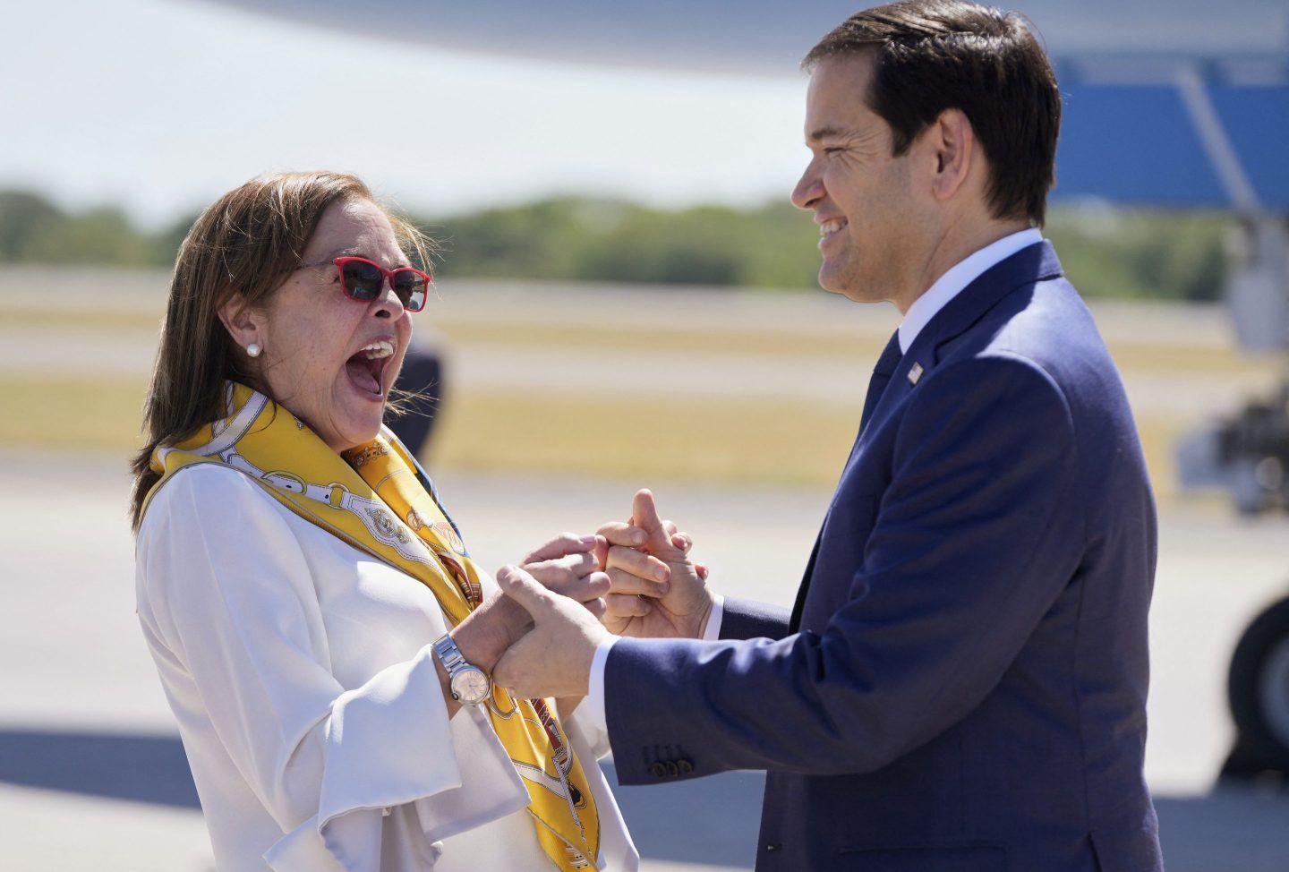 El Salvador's Foreign Minister Alexandra Hill Tinoco welcomes US Secretary of State Marco Rubio upon his arrival at El Salvador International Airport in San Luis Talpa, El Salvador on Febr. 3, 2025.