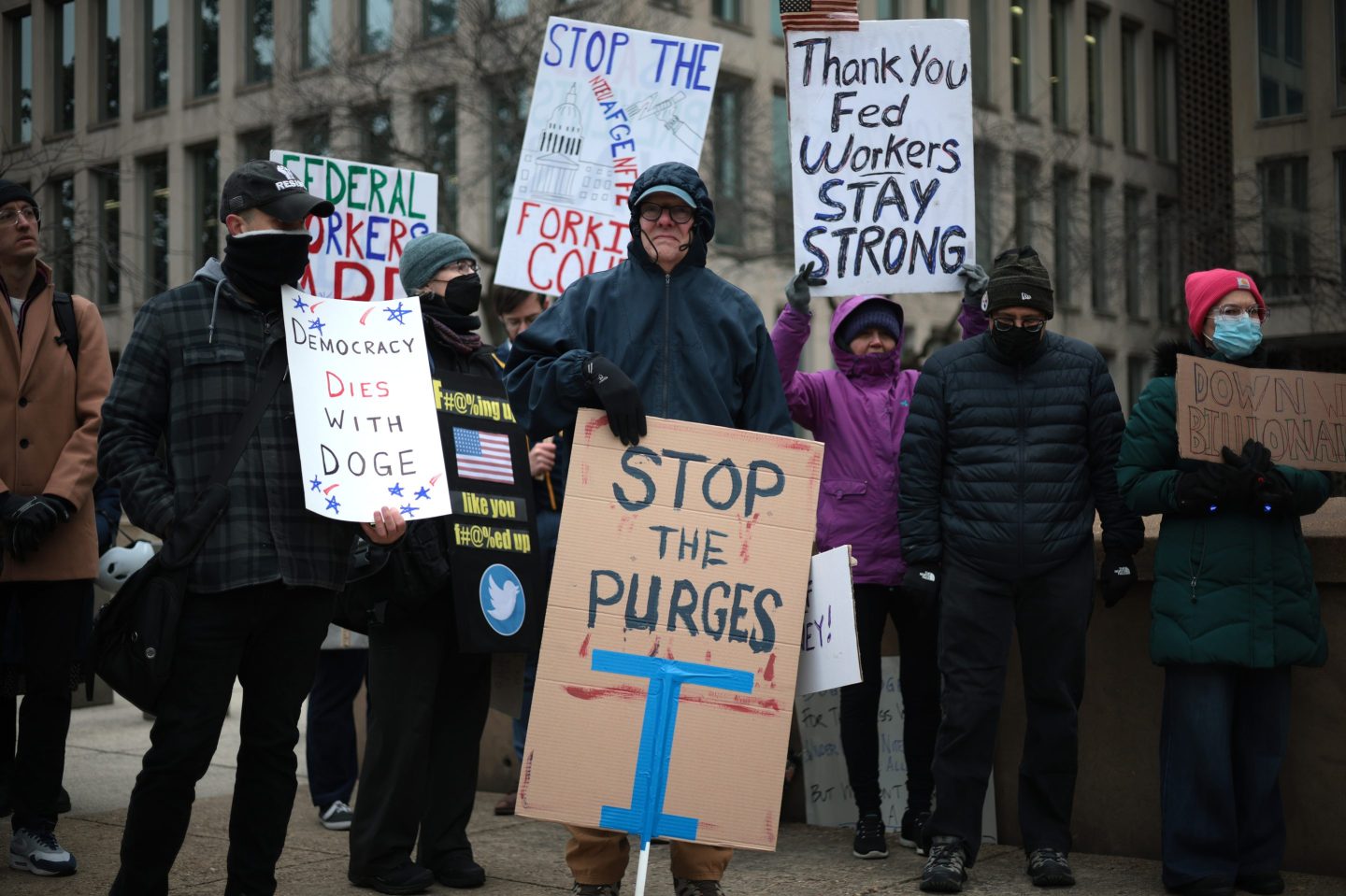 Protesters rally outside the Theodore Roosevelt Federal Building headquarters of the U.S. Office of Personnel Management on Feb. 5, 2025, in Washington, D.C. 