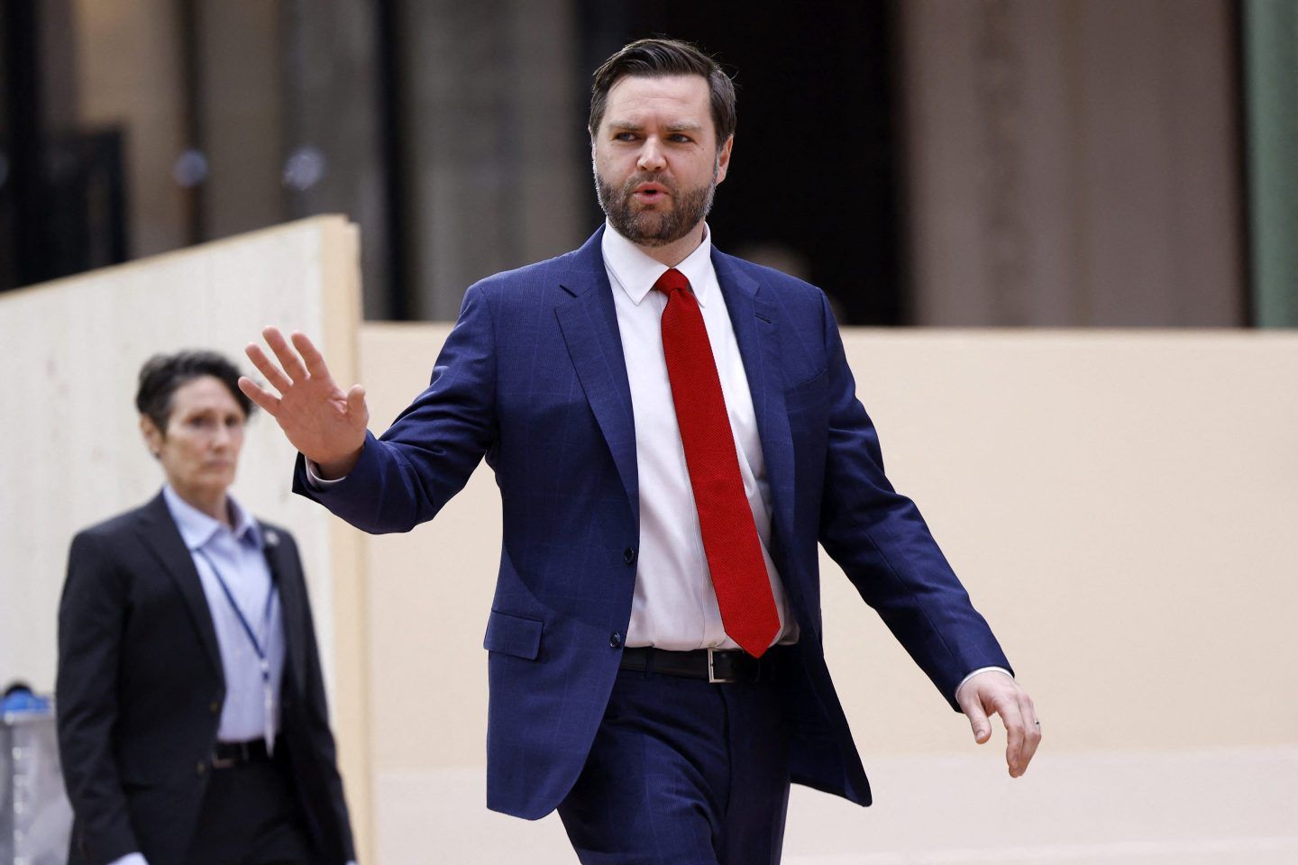 JD Vance waves as he arrives at the global AI Summit in Paris