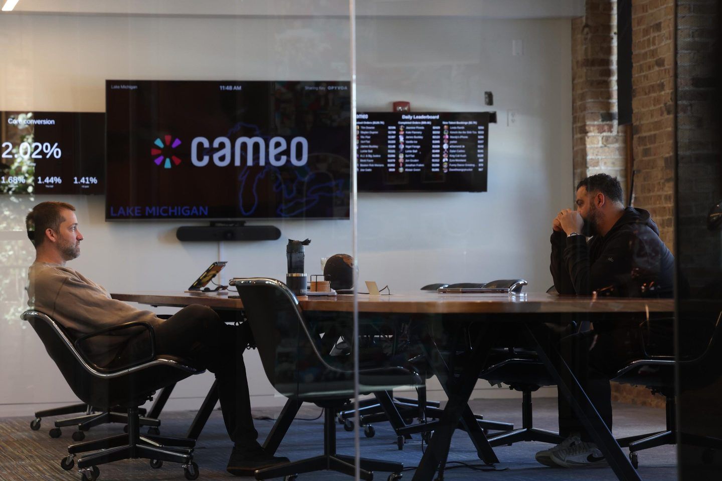 Chief Technology Officer Dom Scandinaro, left, and Steven Galanis, CEO, meet in a boardroom at Cameo, the Chicago-based celebrity video messaging company, on Feb. 13, 2025.