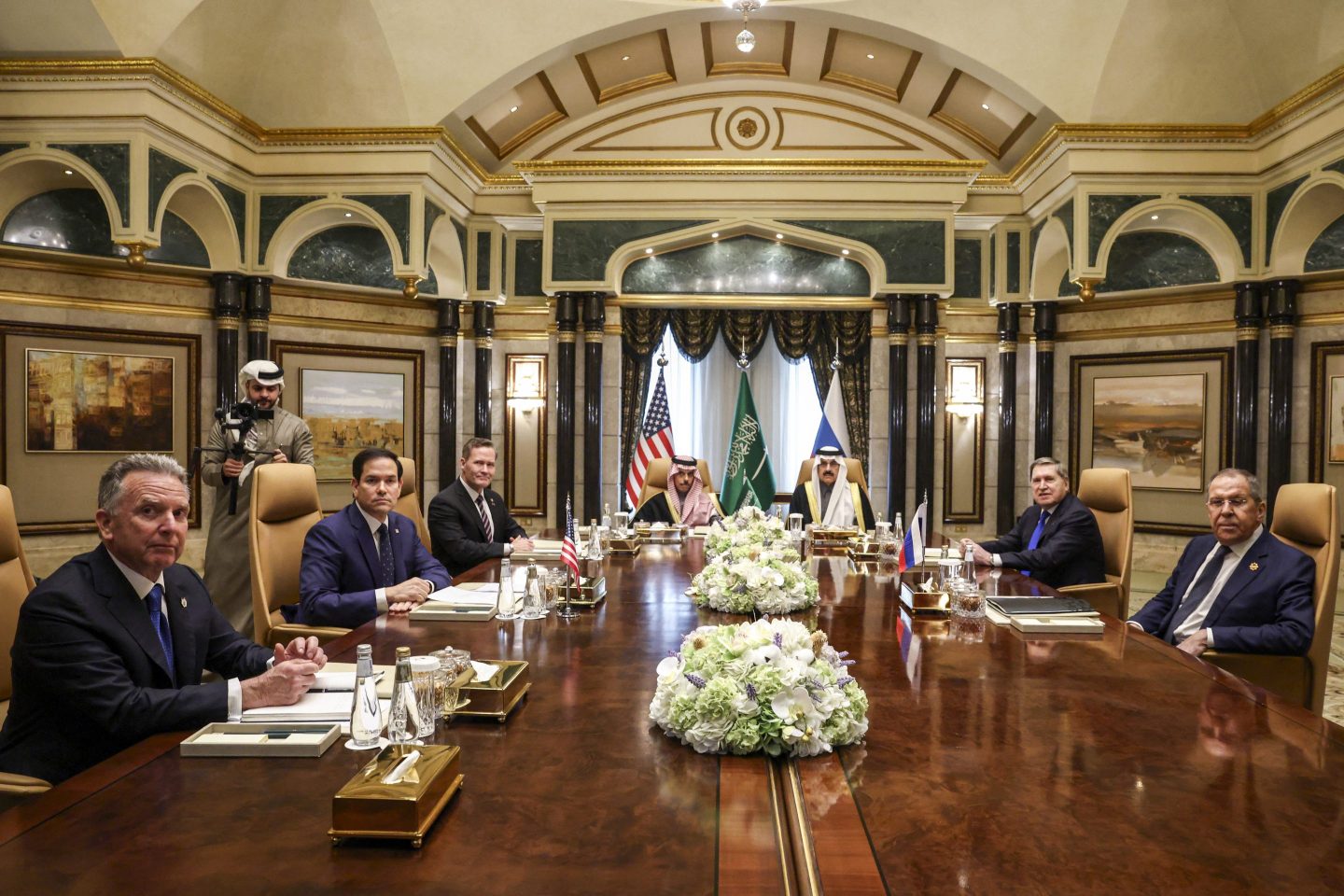 U.S. and Russian emissaries sit at a table
