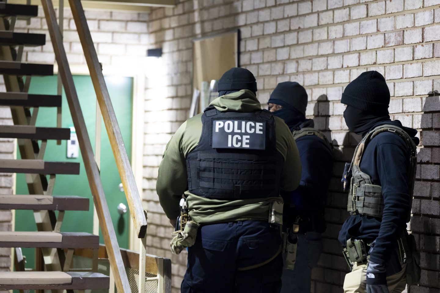 U.S. Immigration and Customs Enforcement officers wait to detain a person, Jan. 27, 2025, in Silver Spring, Md. 