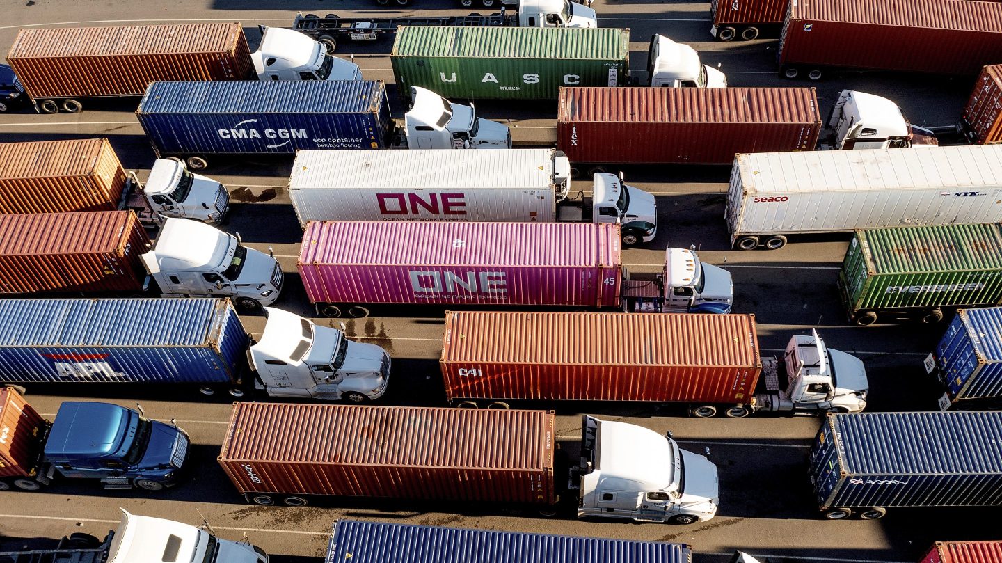 Trucks line up to enter a Port of Oakland shipping terminal on Nov. 10, 2021, in Oakland.