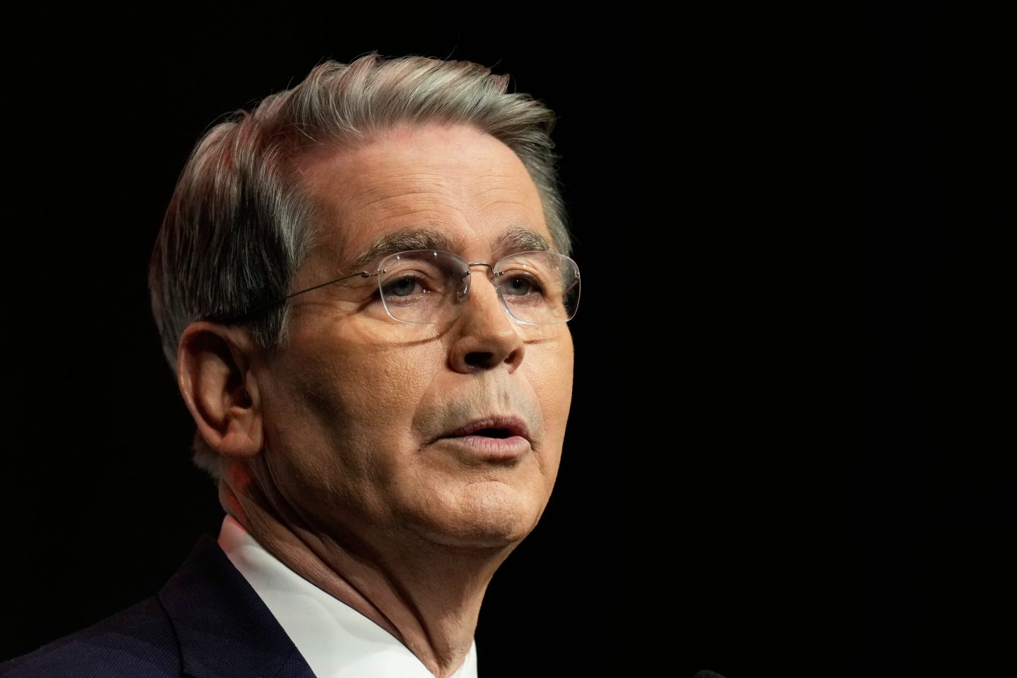 Scott Bessent in front of a black background