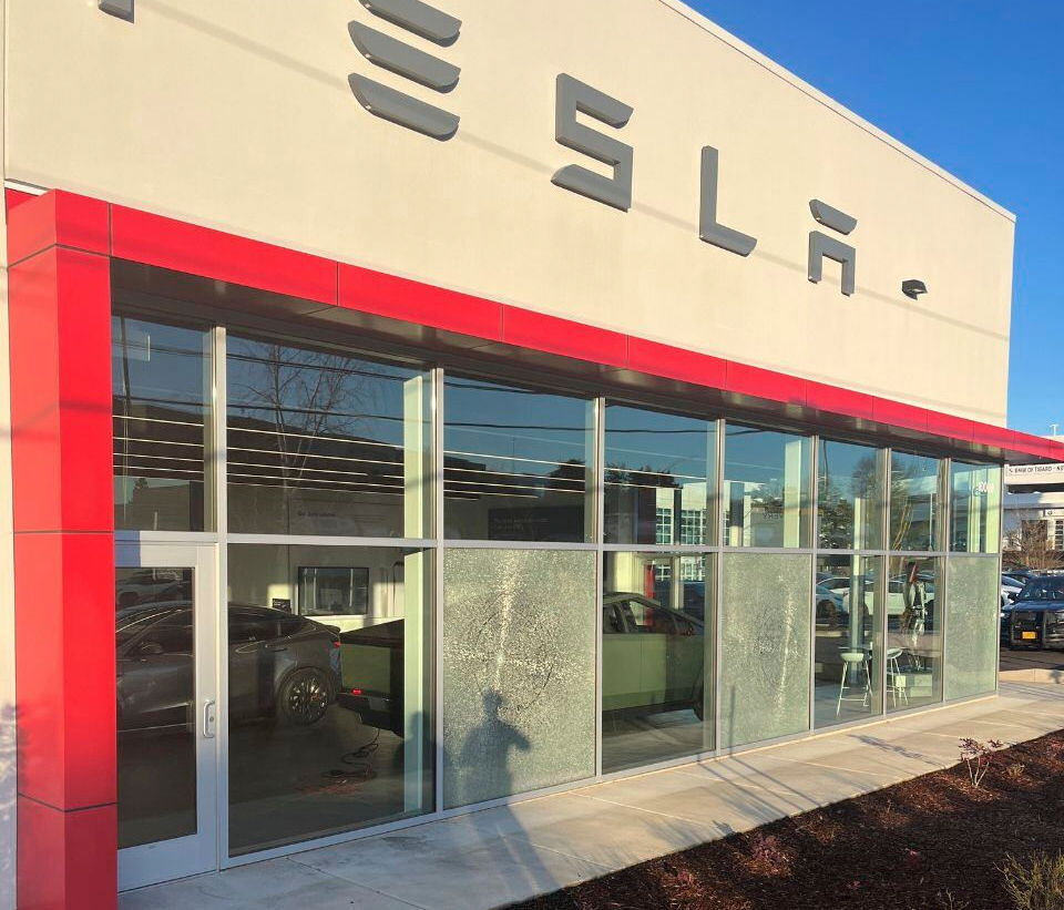 Shattered windows of a Tesla dealership, on March 6, 2025, in Tigard. Oreg.