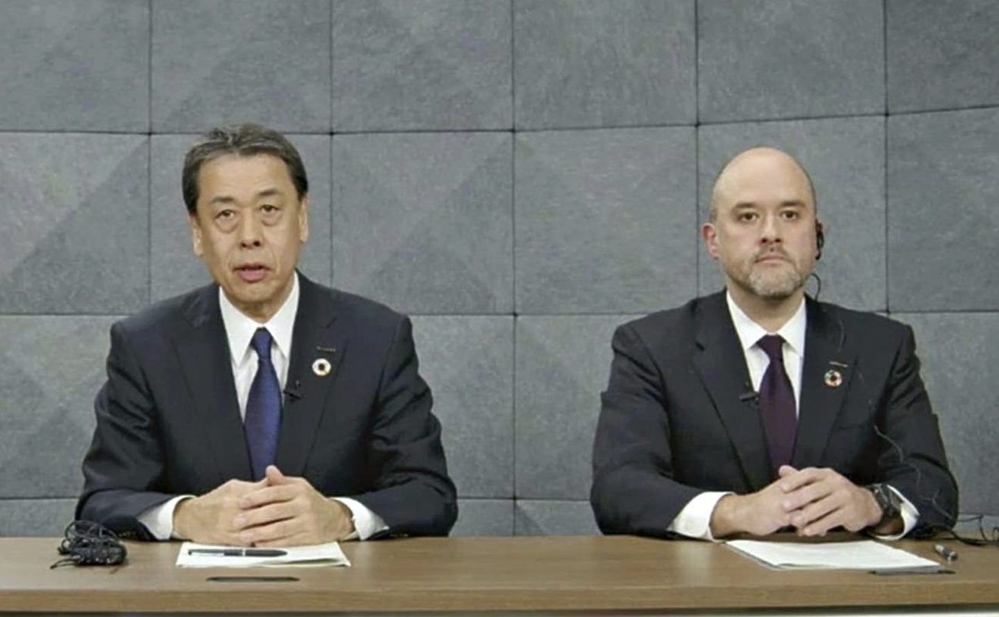Outgoing Nissan CEO Makoto Uchida sits next to incoming CEO Ivan Espinosa