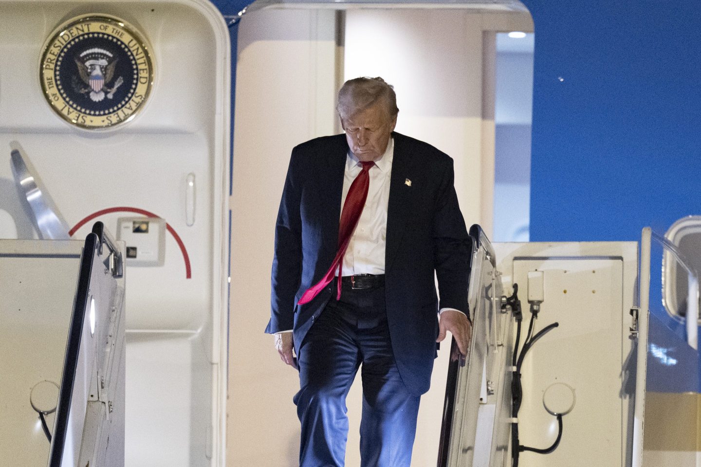 President Donald Trump arrives on Air Force One at Palm Beach International Airport on Friday.