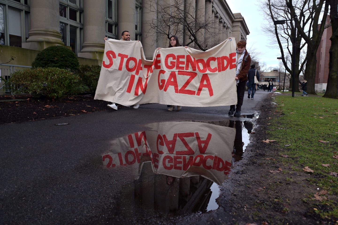 A sign reads "stop genocide in Gaza"