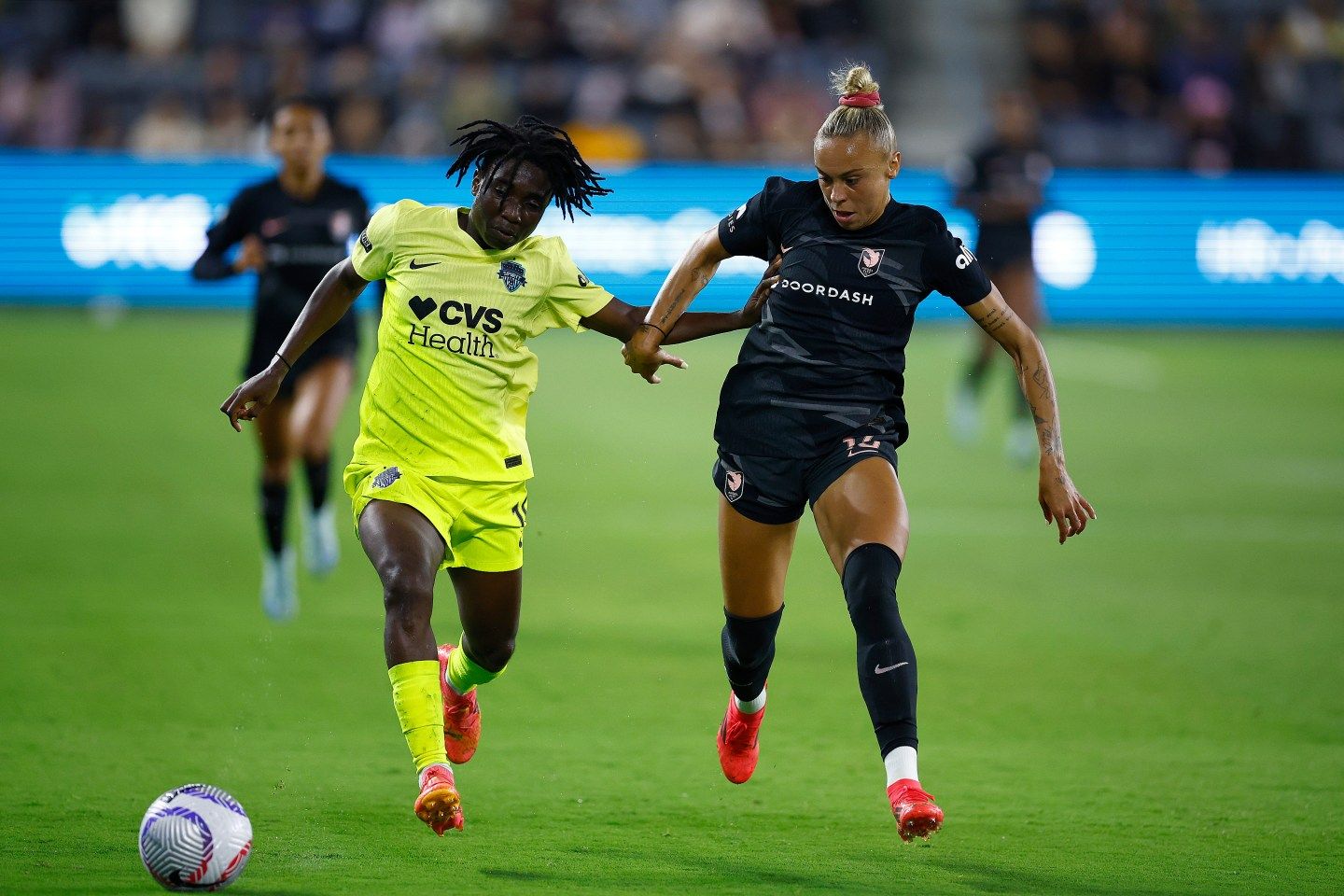 Angel City FC, seen here facing off against the Washington Spirit, are part of Monarch Collective's $250 million fund investing in women's sports. 