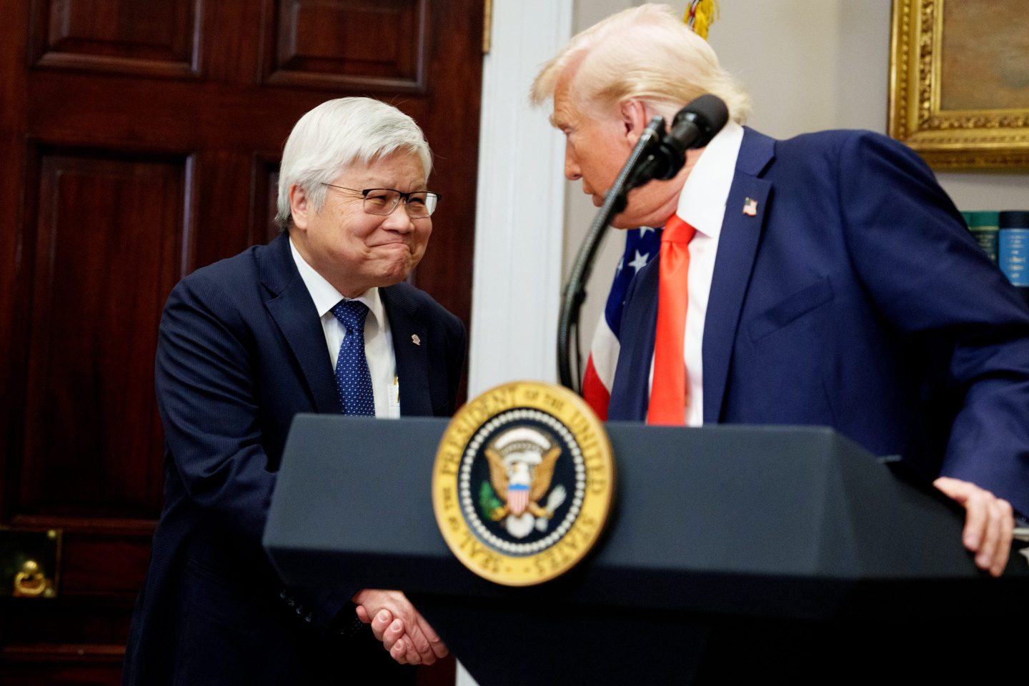 President Donald Trump (R) shakes ands with TSMC CEO C.C. Wei in the Roosevelt Room of the White House on March 3, 2025 in Washington D.C. Trump had announced that TSMC planned to invest $100 in new manufacturing facilities in the U.S.