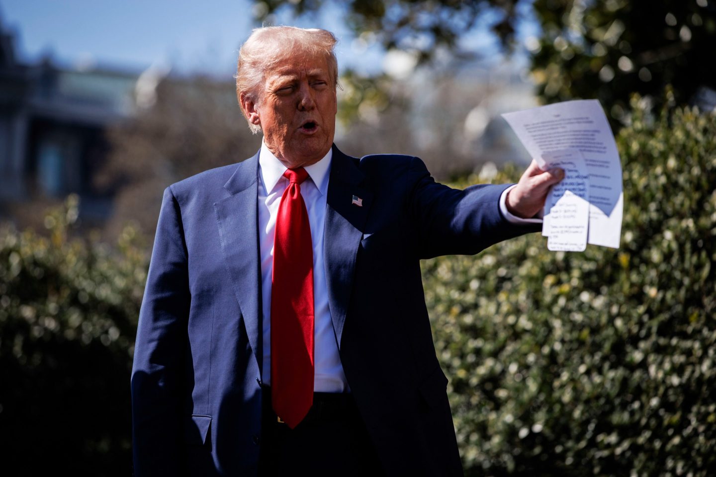 US President Donald Trump speaks to members of the media while looking at Tesla vehicles on the South Lawn of the White House in Washington, DC, US, on Tuesday, March 11, 2025.