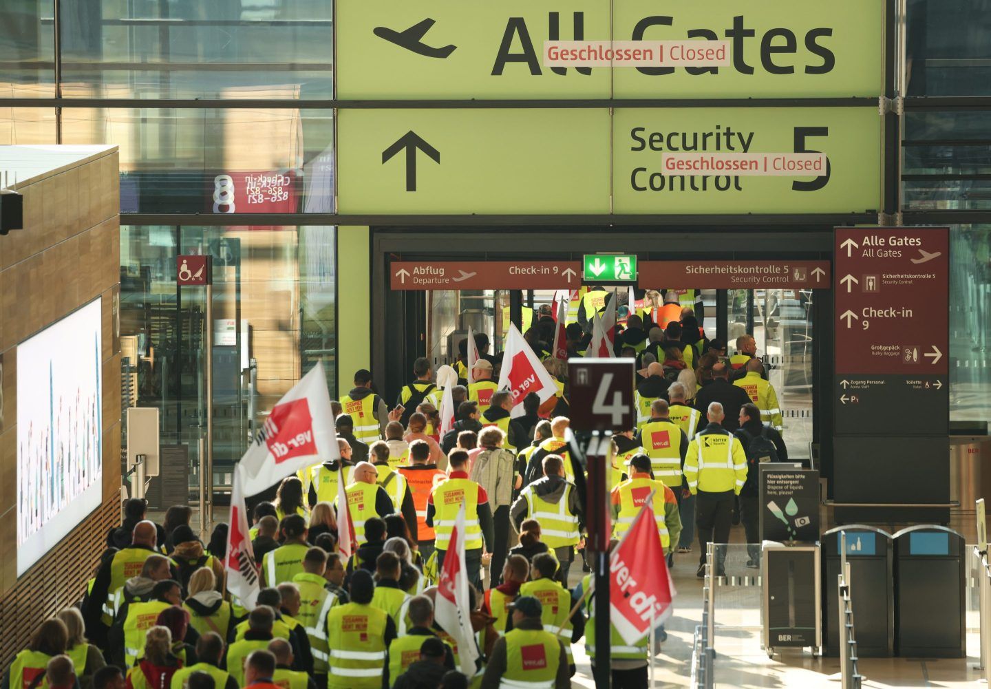 Airport workers stage a walkout, part of a 24-hour strike, in Germany