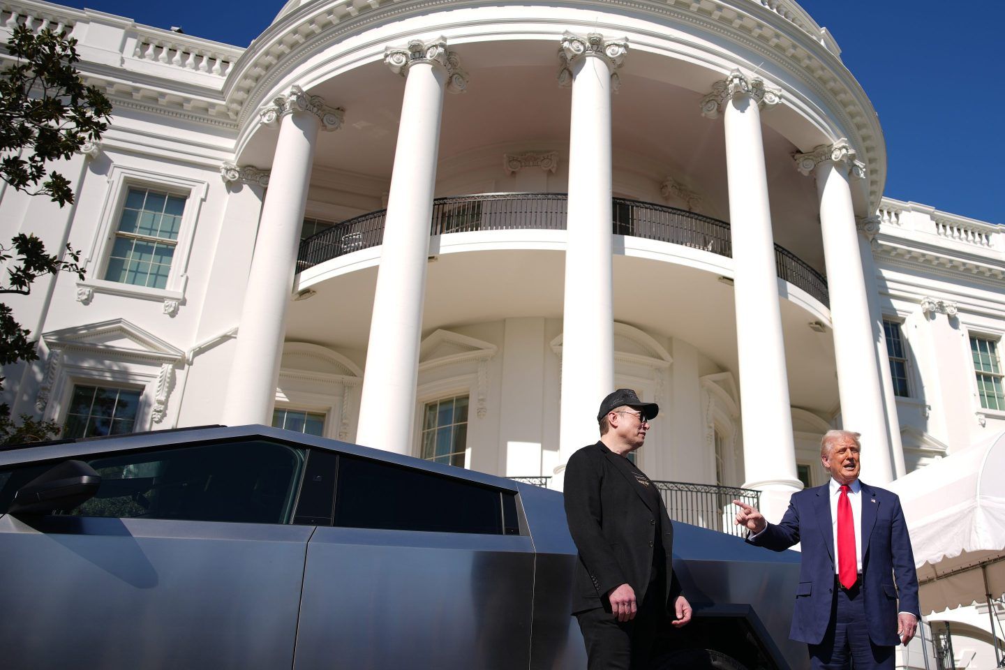 U.S. President Donald Trump and White House Senior Advisor, Tesla and SpaceX CEO Elon Musk deliver remarks next to a Tesla Cyber Truck on the South Lawn of the White House on March 11, 2025 in Washington, DC.