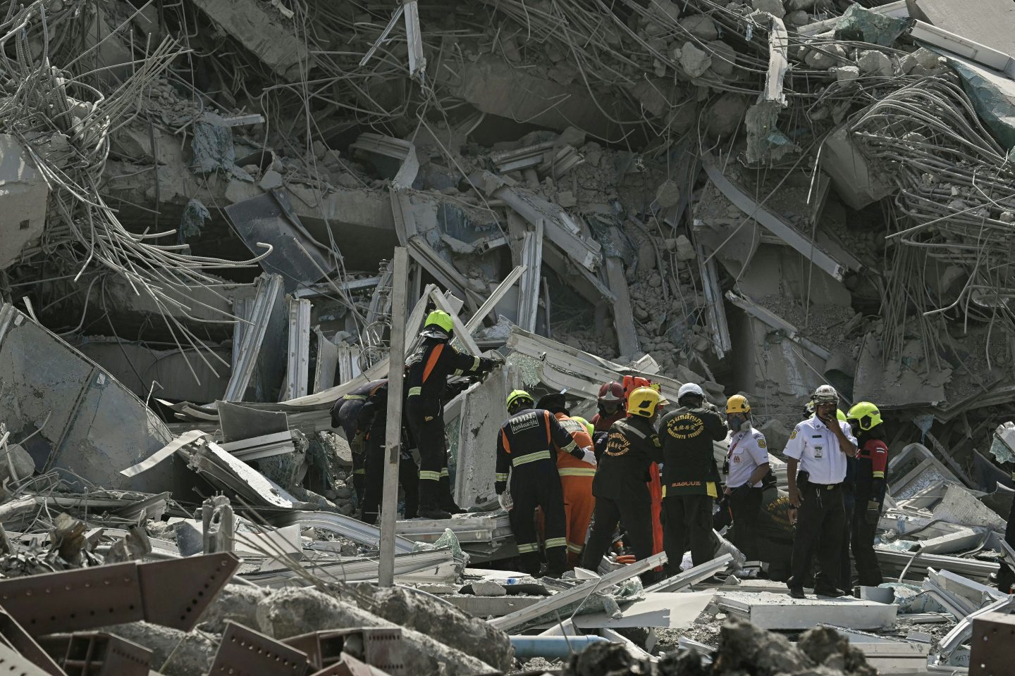 Rescue teams are seen at a construction site where a building collapsed in Bangkok on March 28, 2025, after an earthquake.
