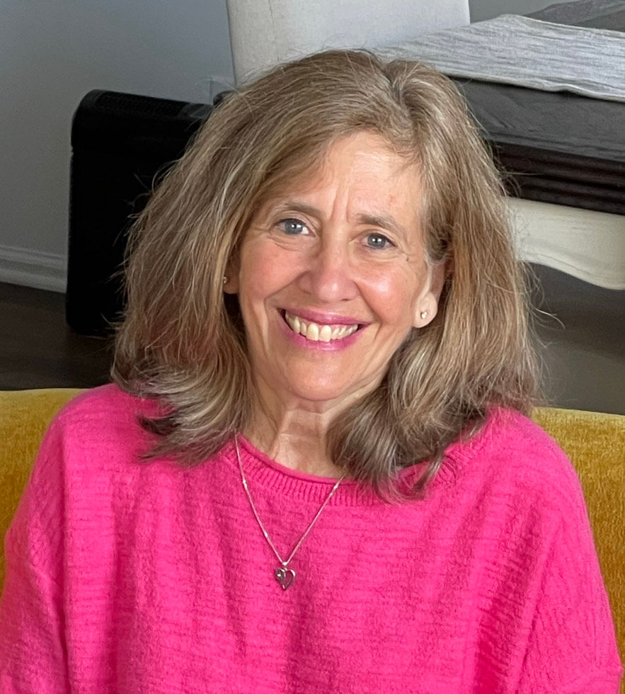 closeup of middle-aged woman in hot-pink top
