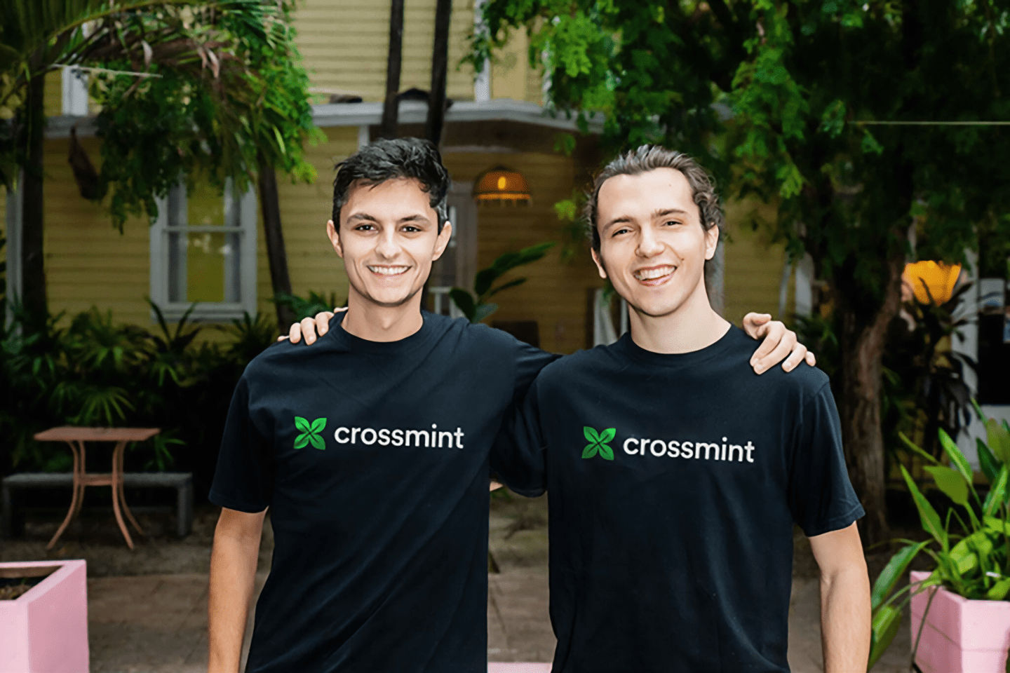 Crossmint's two cofounders standing together smiling.