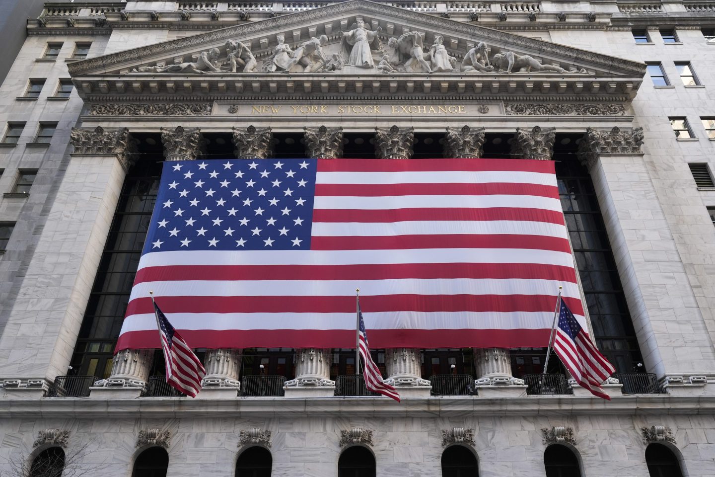 The American flag hangs over the New York Stock Exchange