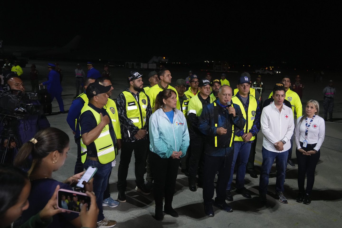 Venezuelan Interior Minister Diosdado Cabello, center, speaks to the press during the arrival of Venezuelan migrants deported from the United States at Simon Bolivar International Airport in Maiquetia, Venezuela, on March 24, 2025.