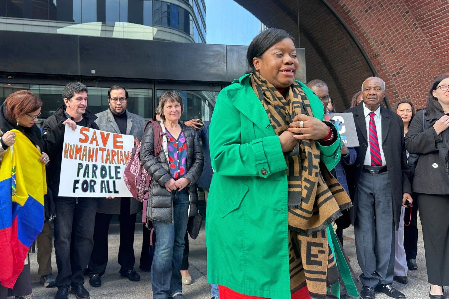 Immigration advocates speak on April 10, 2025, outside federal court in Boston.