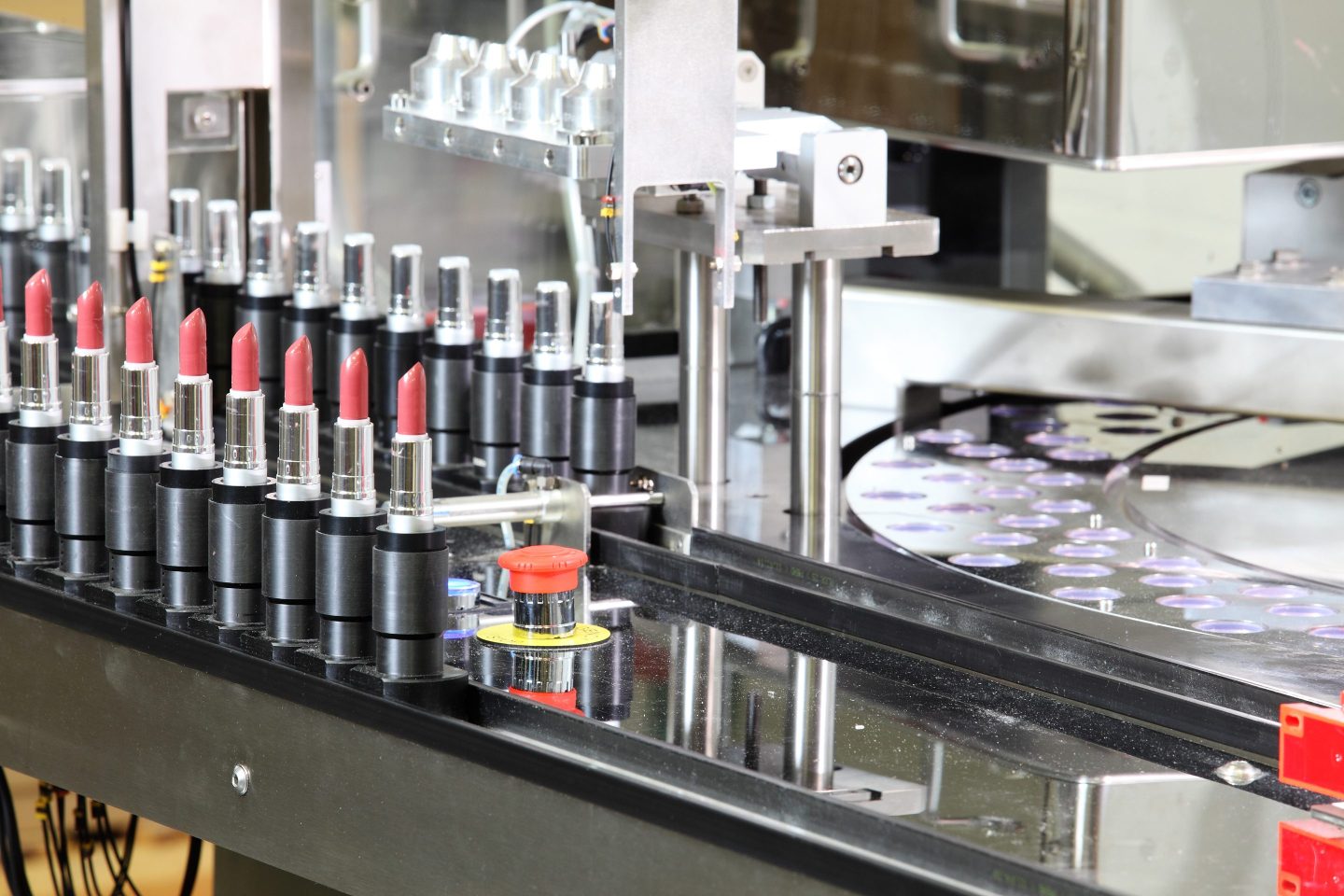 Lipsticks being maufactured in a factory.