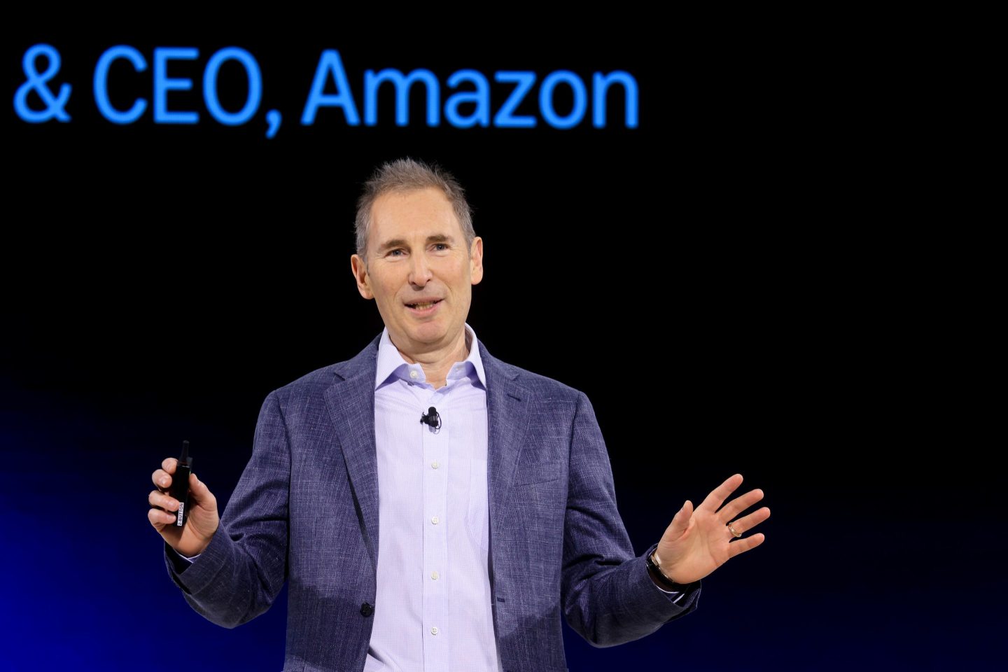 Amazon CEO Andy Jassy gesticulating onstage during a 2025 Alexa event.