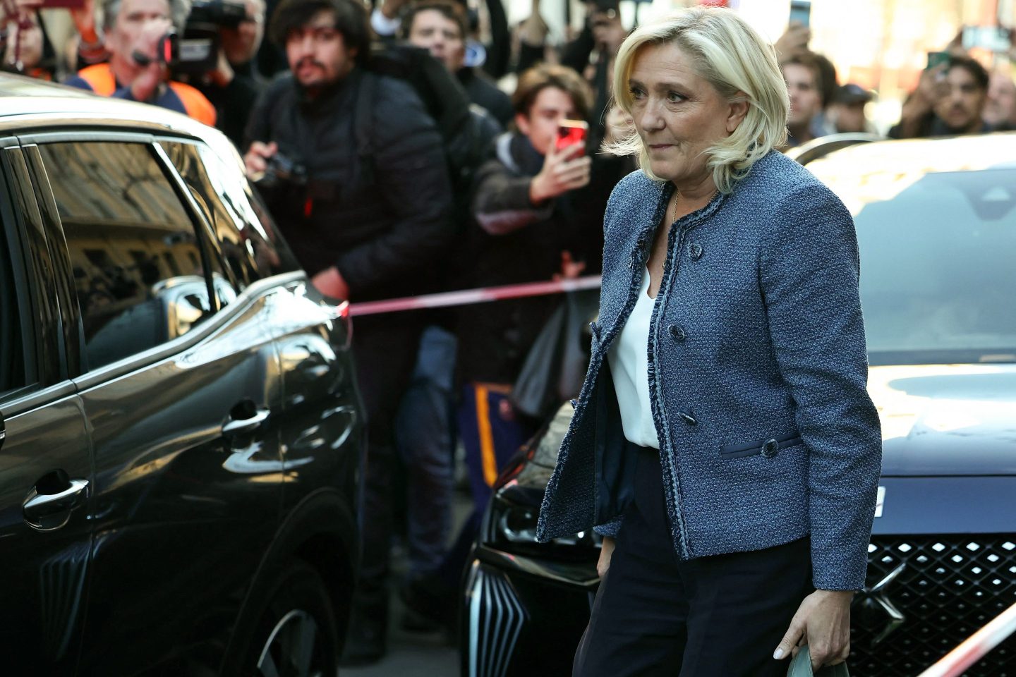 Marine Le Pen leaves the headquarters of the French far-right Rassemblement National (RN) party.