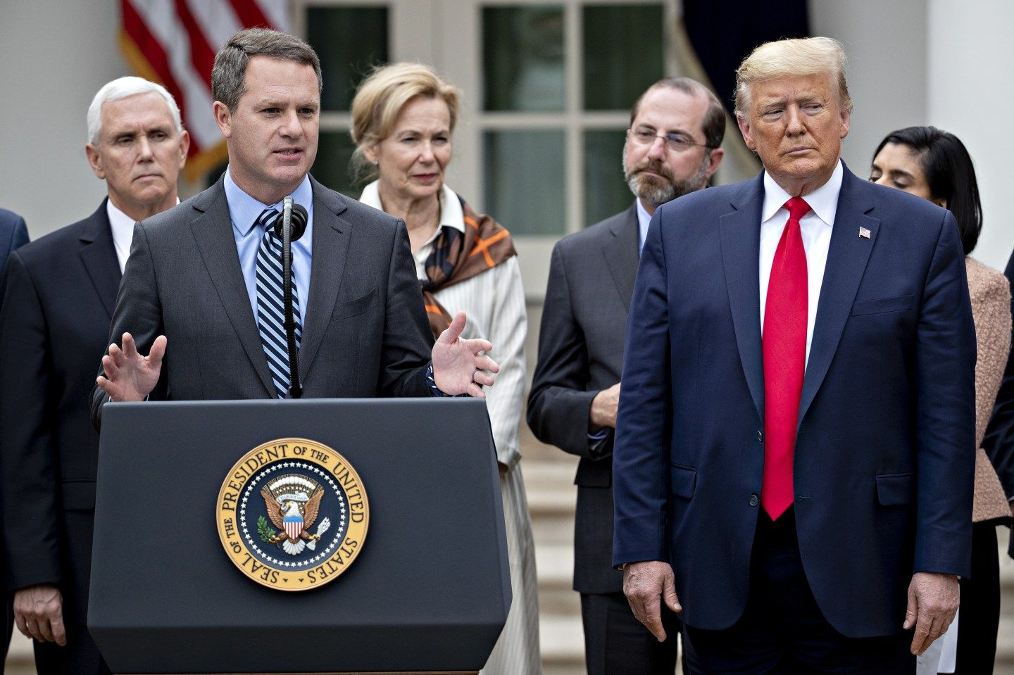 Walmart CEO Doug McMillon speaking at a White House press conference alongside Donald Trump and other leaders